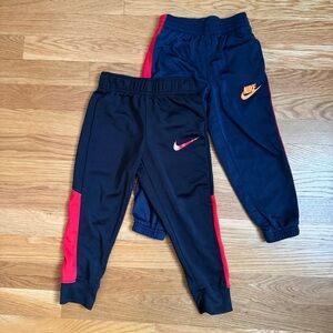 Nike Kids Navy and Black Joggers with Red and Orange Logos